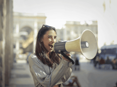 Girl with Megaphone Illustrating Effective Calls-to-Action in Marketing Strategies