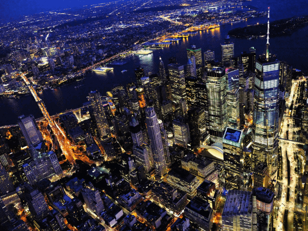 New York City skyline at night with illuminated lights representing a competitive and saturated market